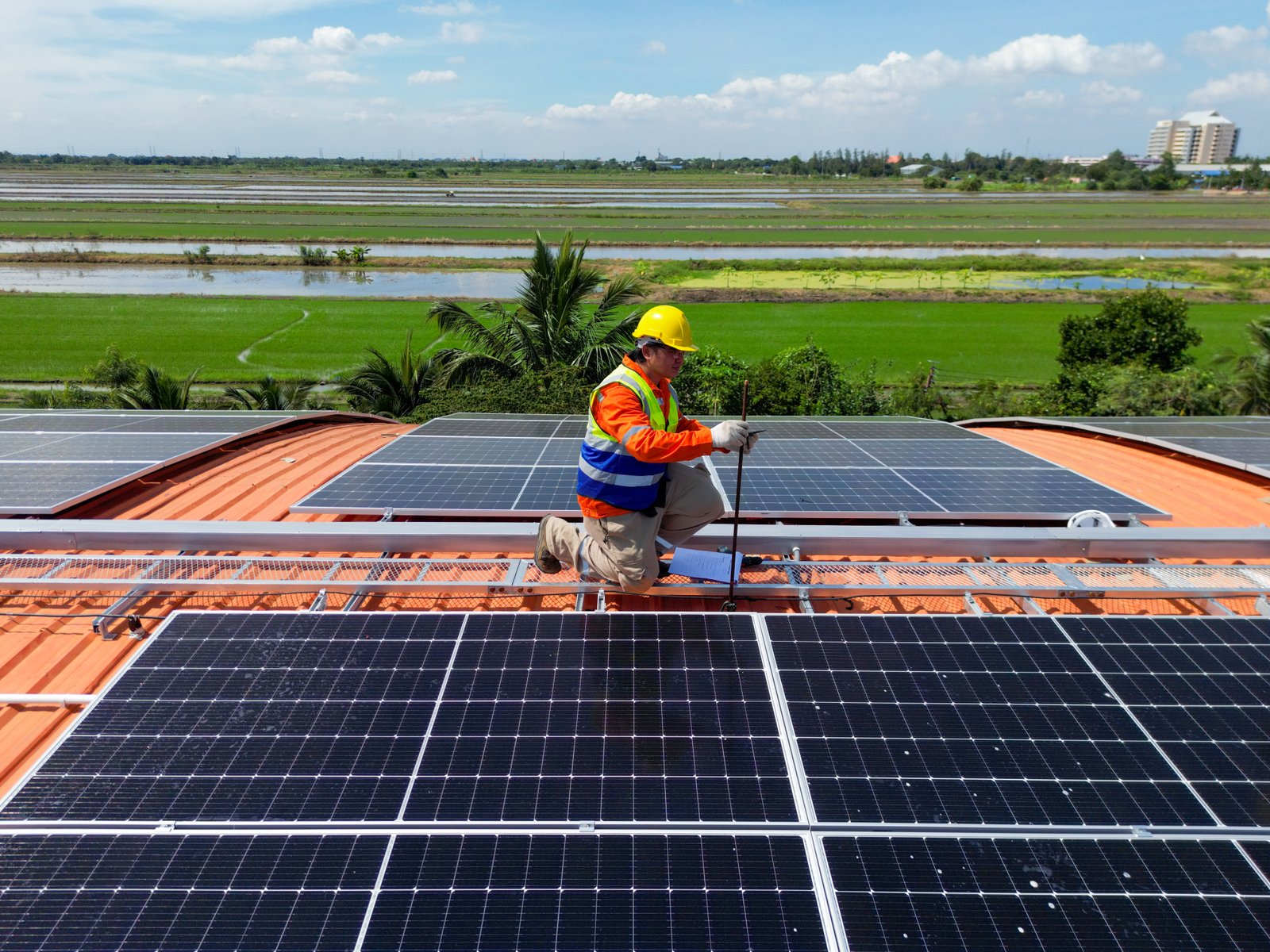 Solar technician installing panels
